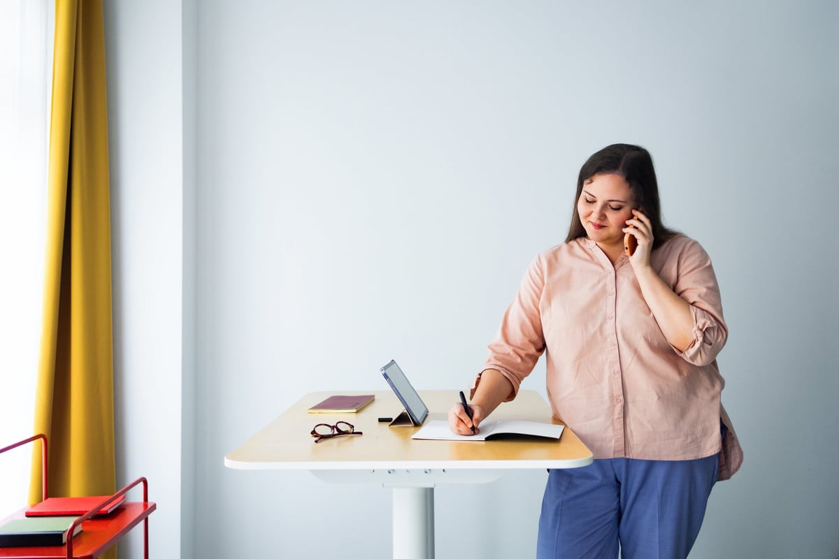 Woman working at properly set up desk